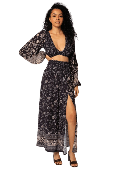 Midnight‑blue floral smocked midi skirt with high‑leg slit and flowing drape
