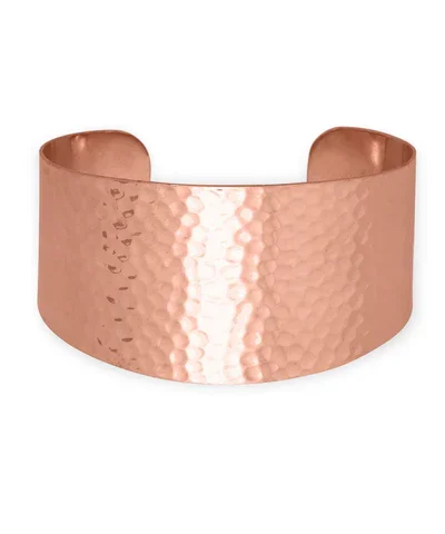 Set of solid copper hand‑hammered cuff bracelets.