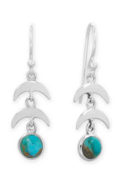 Sterling silver moon‑drop earrings with turquoise accents.