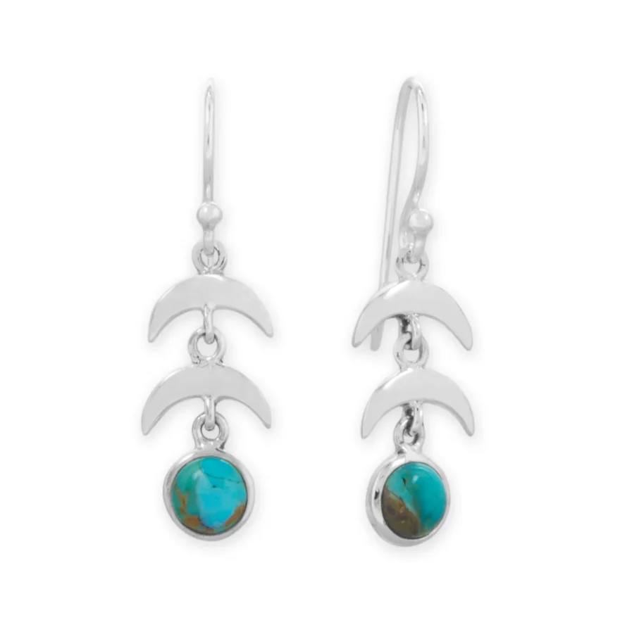 Sterling silver moon‑drop earrings with turquoise accents.