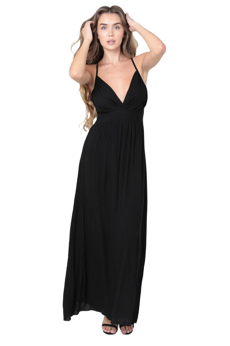 woman wearing a black rayon V‑neck maxi dress with slim straps and flowing silhouette. Style #B4Y27-ASIS
