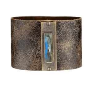 Genuine leather cuff with polished labradorite center stone and handcrafted design.