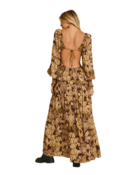 Amber floral open‑back keyhole maxi dress with long puff sleeves and a tiered skirt.