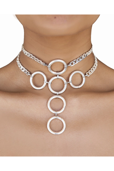 Close-up of the Selene silver choker on a model, showcasing the double curb chain and the geometric pattern of six interlocking silver rings cascading down the neck.