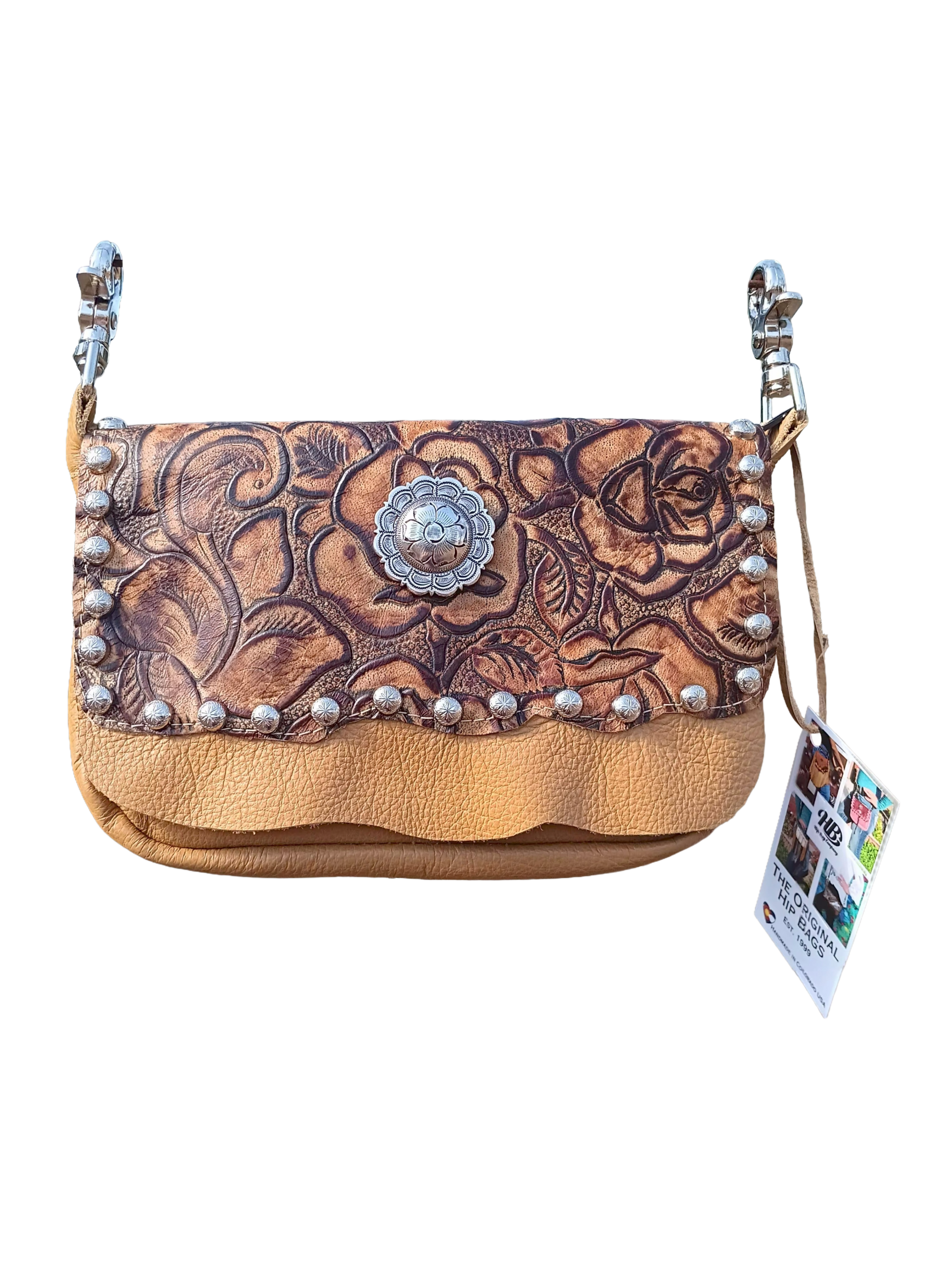 Buckskin hip bag with metallic golden‑rose leather print, silver studs, and circular silver concho.