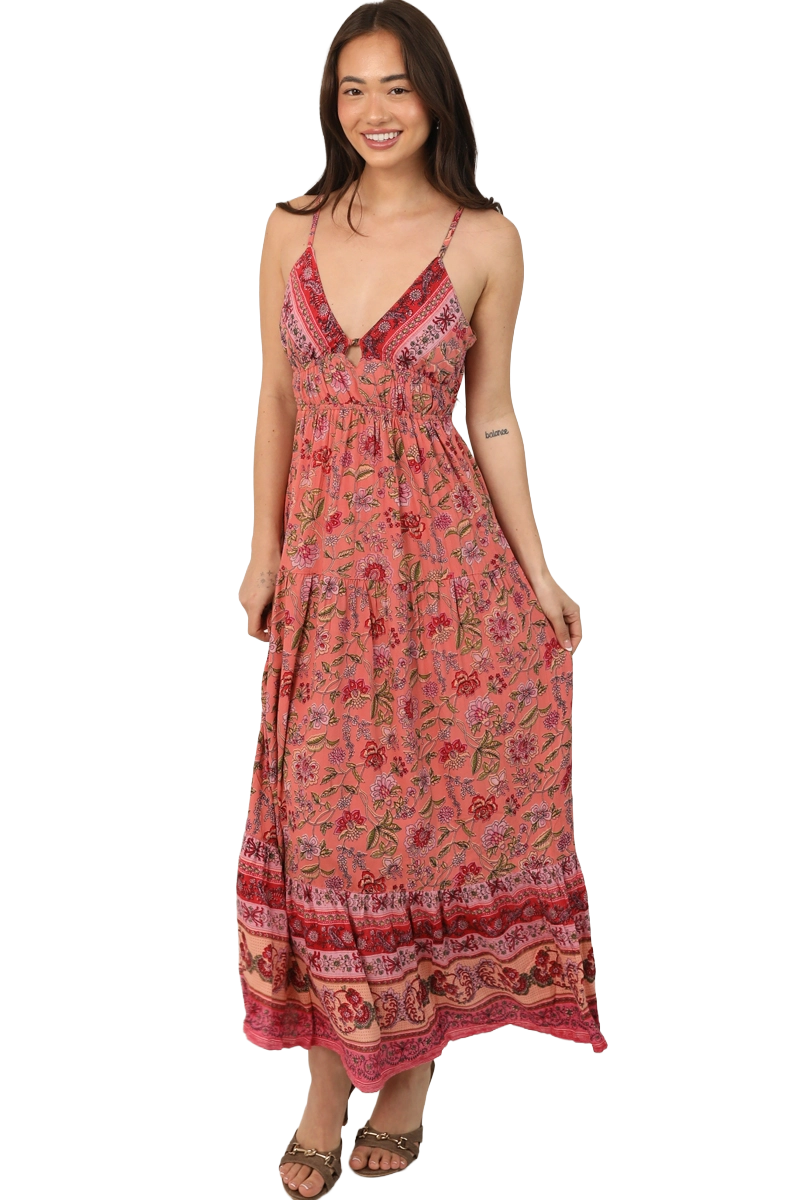 Front view of a coral wildflower‑print maxi dress with V‑neckline and flowing A‑line silhouette