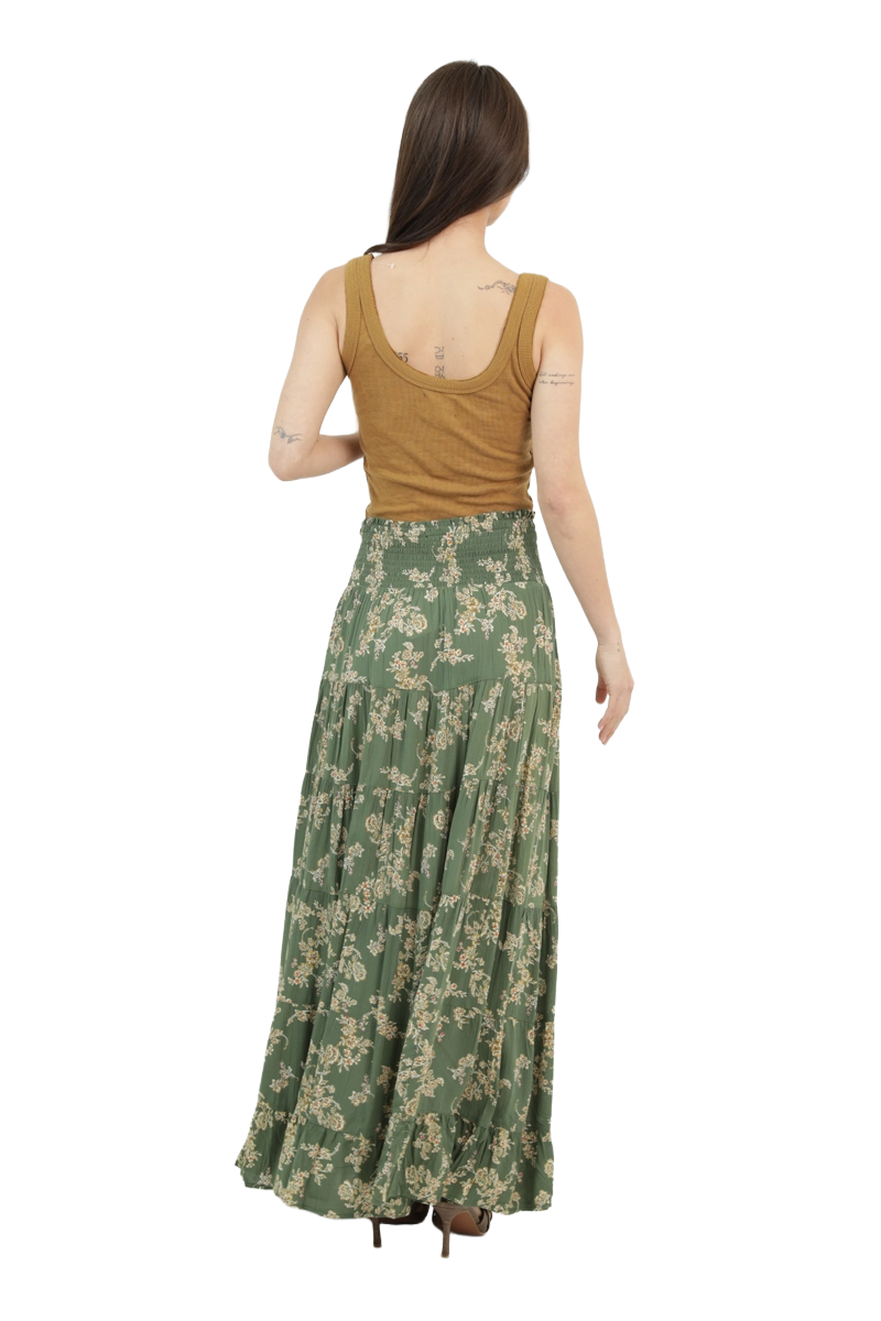 Back view of an olive floral A‑line maxi skirt featuring a smocked waistband and soft, tiered drape.